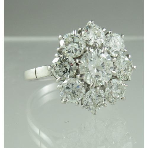 233 - Diamond cluster ring of a central brilliant cut diamond surrounded by eight brilliant cut diamonds. ... 