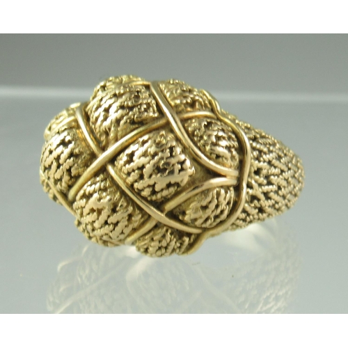 238 - A yellow metal ring heavily engraved and shaped with basketwork shoulders.  Ring size P.  Engraved t... 