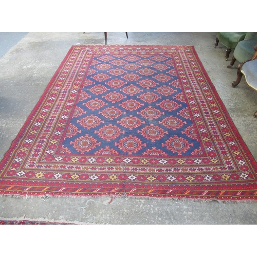 297 - Large Middle Eastern design hand woven carpet on a blue and red ground with central geometric medall... 