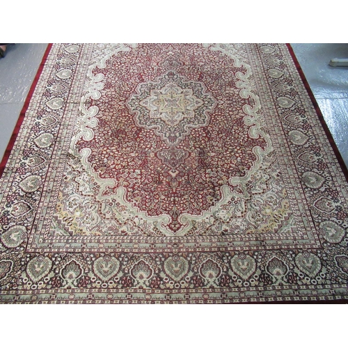 301 - Large modern Kashmiri carpet on a red and cream ground with central floral medallion, overall with g... 