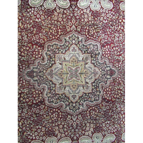 301 - Large modern Kashmiri carpet on a red and cream ground with central floral medallion, overall with g... 