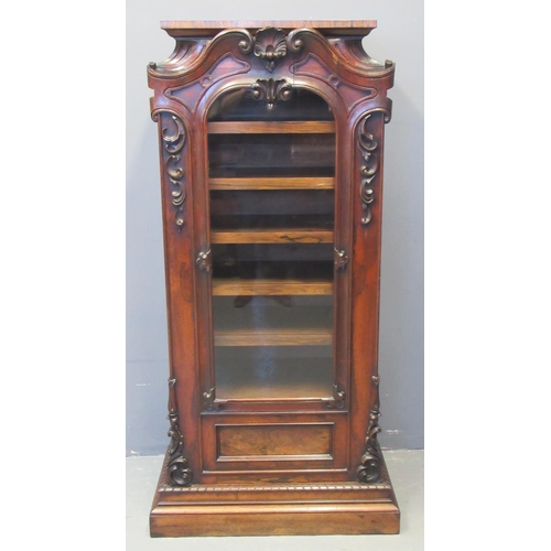 64 - Early 19th century rosewood sheet music cabinet, the moulded top above a single glazed arched door o... 