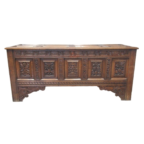 68 - 18th century oak coffer, the associate fielded and moulded top above a carved frieze of flower heads... 