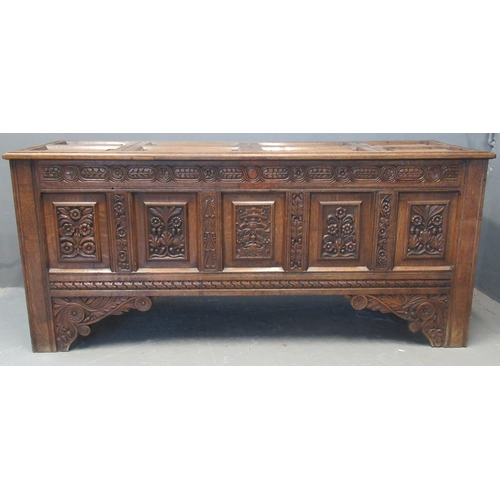 68 - 18th century oak coffer, the associate fielded and moulded top above a carved frieze of flower heads... 