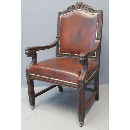 69 - Late 19th early 20th century carved oak carver chair, the shaped back with carved frieze above a lea... 