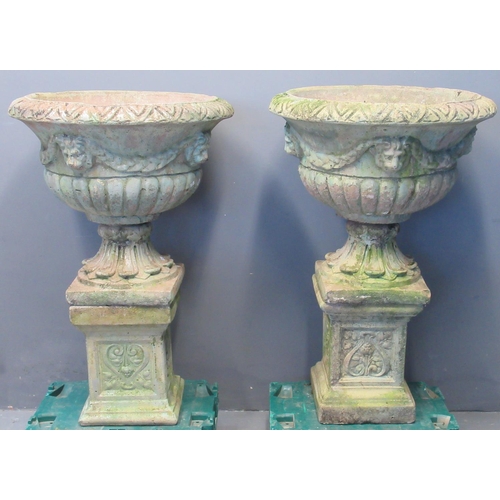 77 - Pair of 20th century weathered composition garden Campana shaped urns having moulded lion mask mount... 