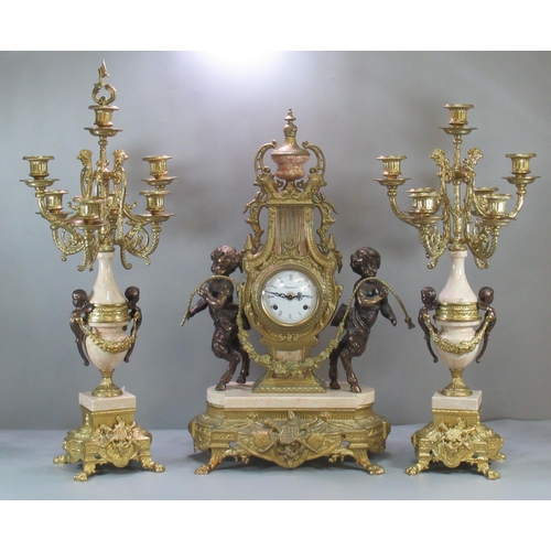 88 - Modern Louis XV style French gilt metal clock garniture, the clock of lyre shape with foliate mounts... 