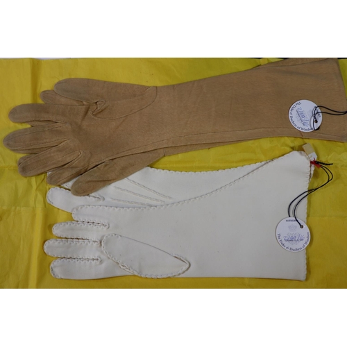 198A - Two pairs of gloves which belonged to the Duchess of Windsor (c. 1945-55).  One pair of elbow length... 