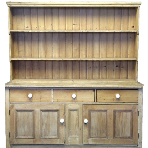 80 - Victorian pine two stage rack back kitchen dresser, the moulded cornice above boarded rack and two f... 