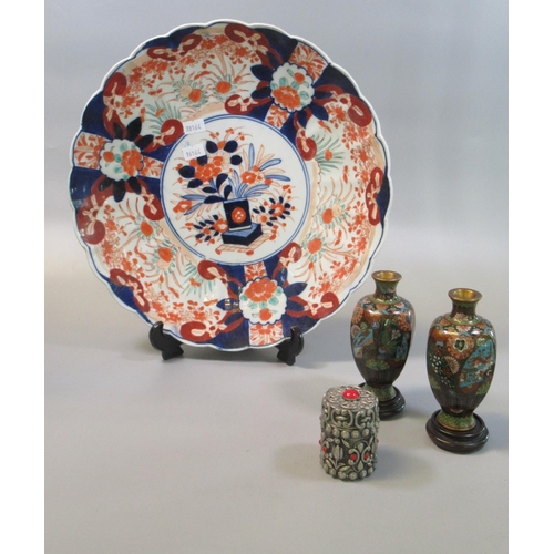 46 - Japanese porcelain Imari dish or charger, together with a pair of cloisonne vases on wooden bases an... 