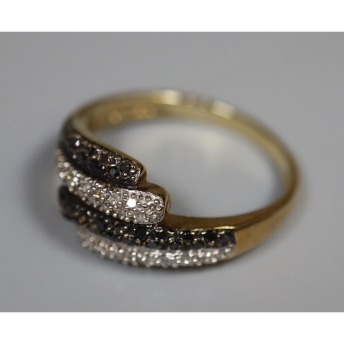 228 - 9ct gold four band  diamond and stone set snake ring.  2.5g approx. size O.  (B.P. 21% + VAT)