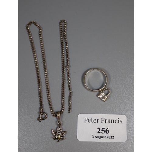 236 - Tiffany & Co silver dress ring with pendant padlock, together with a white metal chain necklace and ... 