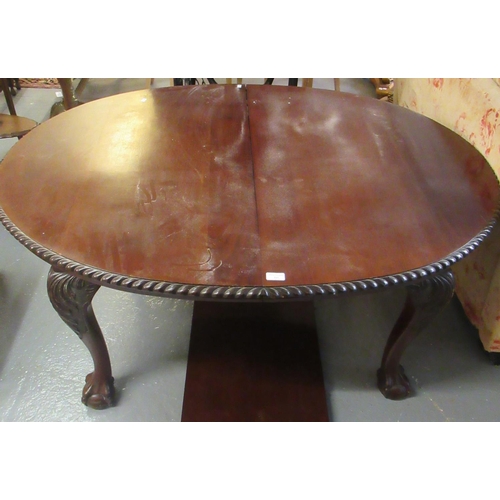 497 - Victorian mahogany extending dining table with one additional leaf, standing on cabriole legs and ba... 