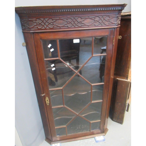 595 - 19th century mahogany single door astragal glazed hanging corner cabinet, the interior revealing thr... 