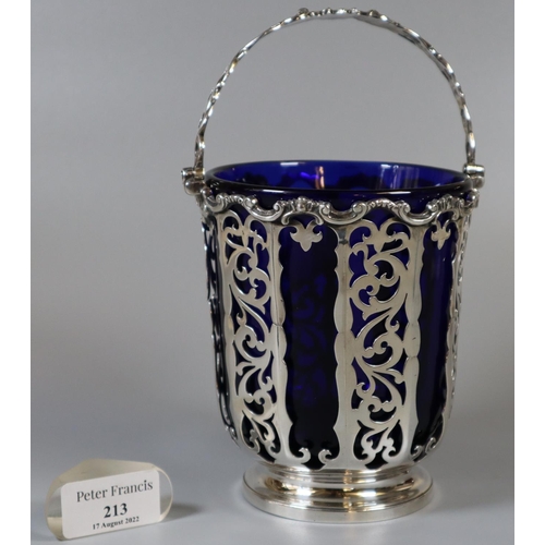 213 - Victorian silver and pierced basket with swing handle and Bristol Blue glass liner by George John Ri... 