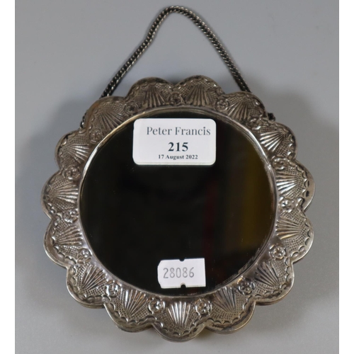 215 - White metal repousse decorated hanging mirror with domed foliate and scrollwork back.  Unmarked.  (B... 