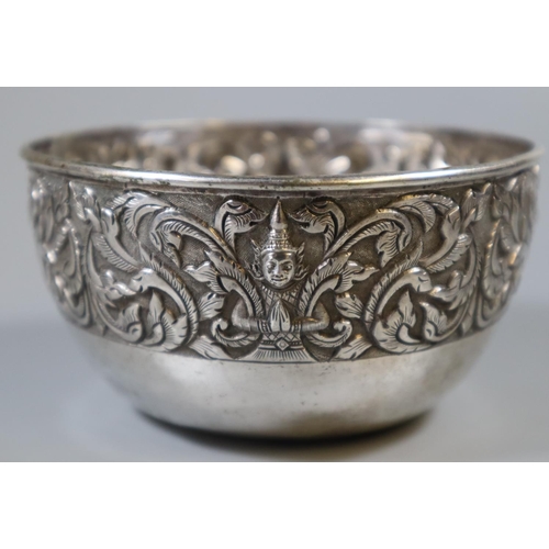 216 - Indian or Siamese repousse silver bowl decorated with foliate designs and Buddhistic figures.  Unmar... 