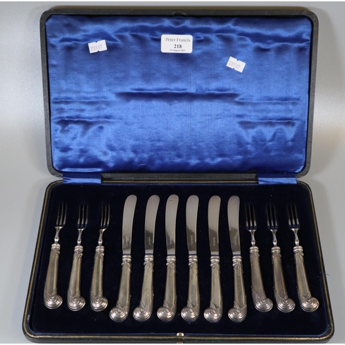 218 - Cased set of silver pistol handled dessert knives and forks with steel blades, six knives, six forks... 