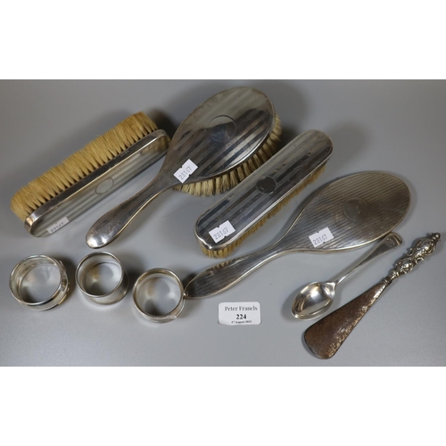 224 - Collection of silver backed dressing table items: brushes, mirror etc, napkin rings, button hook, si... 