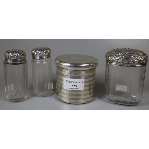 225 - Group of assorted glass dressing table jars, three with repousse silver tops, together with a Goldsm... 