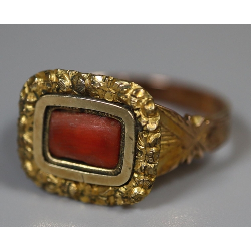 231 - Victorian coral set unmarked gold ring (tests as 9ct) with engraved shank and foliate mount.  Size S... 