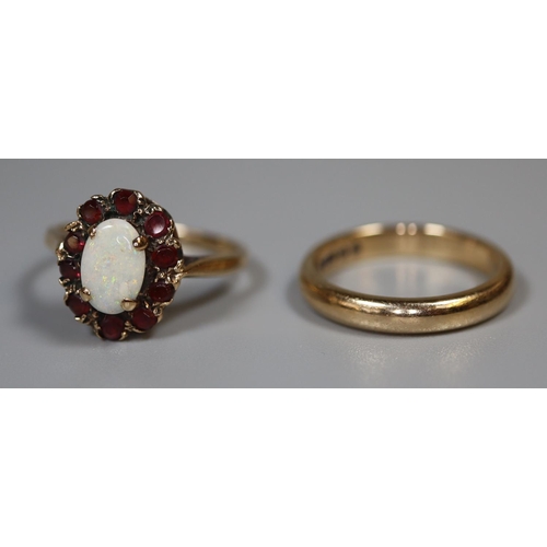 234 - 9ct gold wedding band, size I and a 9ct gold opal and garnet ring size J 4.6g total approx.  Cased. ... 