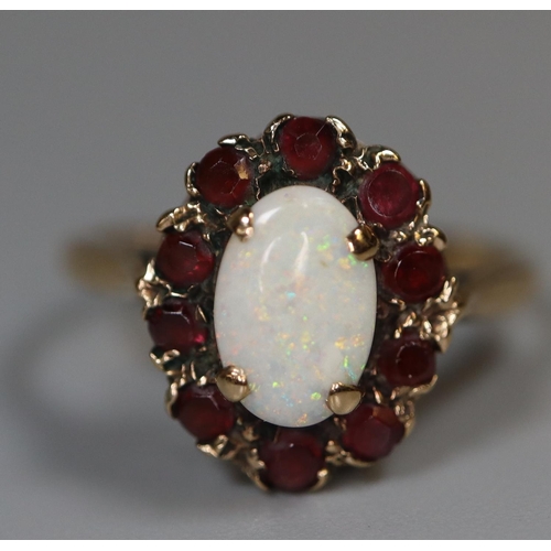 234 - 9ct gold wedding band, size I and a 9ct gold opal and garnet ring size J 4.6g total approx.  Cased. ... 