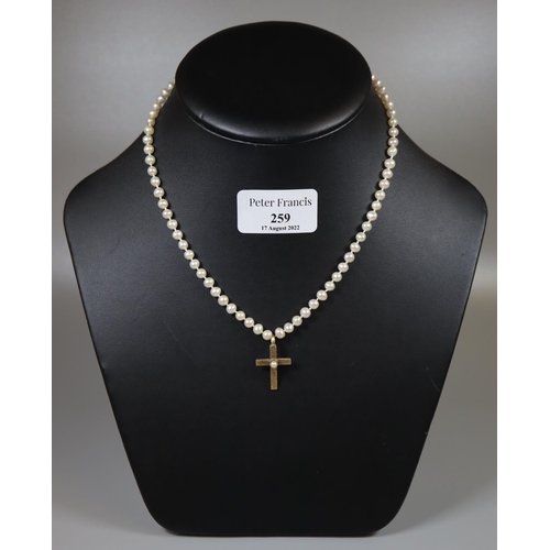 259 - Cultured pearl necklace with 9ct gold pearl set cross and clasp.  Cased.  (B.P. 21% + VAT)