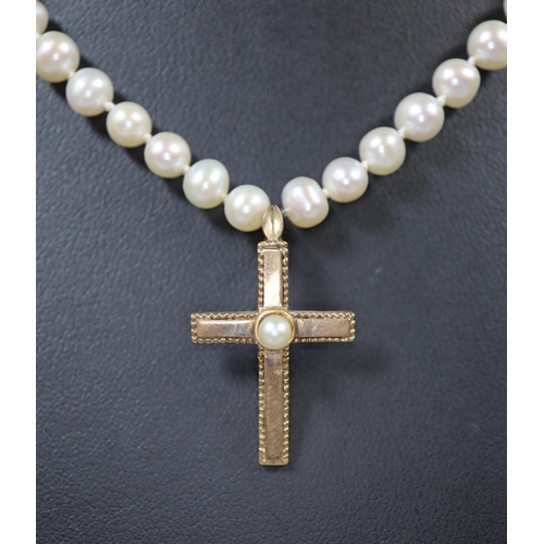 259 - Cultured pearl necklace with 9ct gold pearl set cross and clasp.  Cased.  (B.P. 21% + VAT)