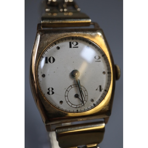 266 - 9ct gold small Ladies 1920s mechanical wristwatch with Arabic face and gold plated expanding bracele... 