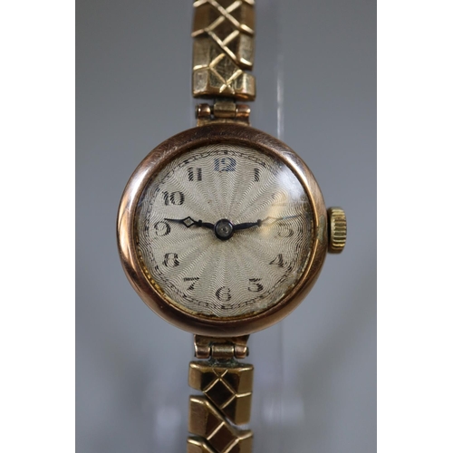 268 - Lady's 9ct gold mechanical wristwatch on expanding gold plated bracelet.  Boxed.  (B.P. 21% + VAT)