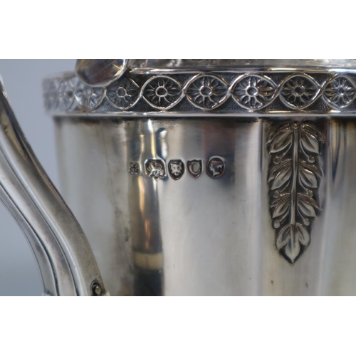 291 - Victorian silver teapot with cast foliate decoration and indented corners.  London hallmarks, marked... 