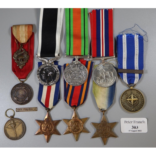 303 - Bag of assorted British WWII war medals and other medals, various, including: For Service in New Zea... 