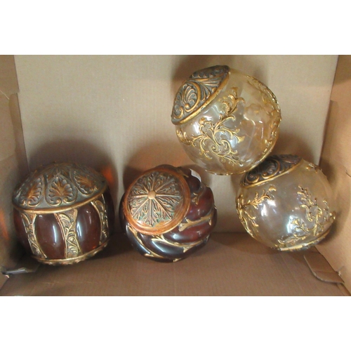 392 - Set of four glass and gilded foliate decorated balls.  (4)
(B.P. 21% + VAT)