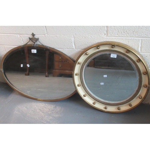 426 - Modern convex type mirror, together with an early 20th century brass framed bevel plate oval mirror ... 