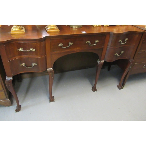 451 - Edwardian mahogany serpentine sideboard standing on cabriole legs and ball and claw feet.  (B.P. 21%... 