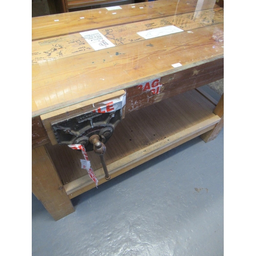 549 - Large rustic pine carpenter's work bench with glass top, vice and under tier.  (B.P. 21% + VAT)