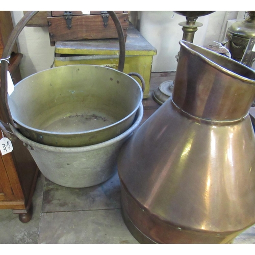 555 - Copper and brass jug together with two preserving pans, one brass.  (3)  (B.P. 21% + VAT)