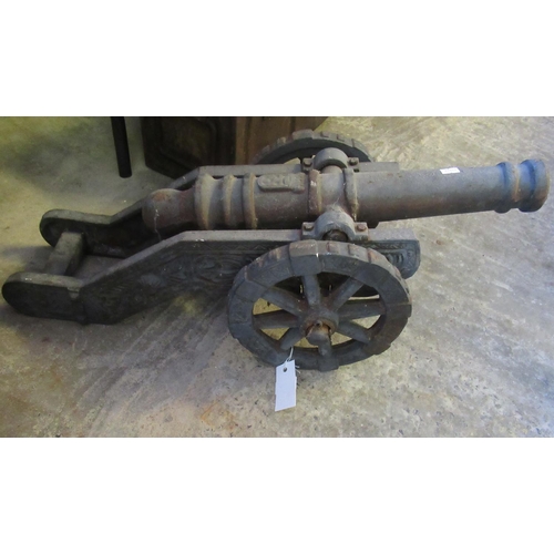 569 - Good quality cast iron cannon on wheels.  (B.P. 21% + VAT)