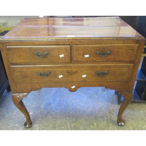 575 - 18th century walnut lowboy, the moulded top above an arrangement of two short and one long drawer, s... 