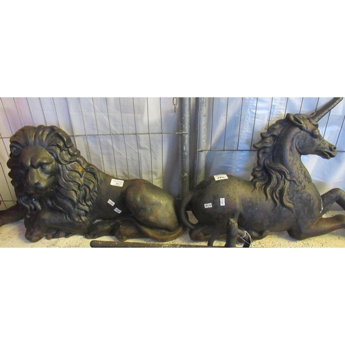 582 - Two cast iron moulded creatures, to include: recumbent male lion and mythical unicorn.  (2)   (B.P. ... 