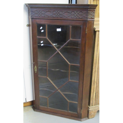 595 - 19th century mahogany single door astragal glazed hanging corner cabinet, the interior revealing thr... 