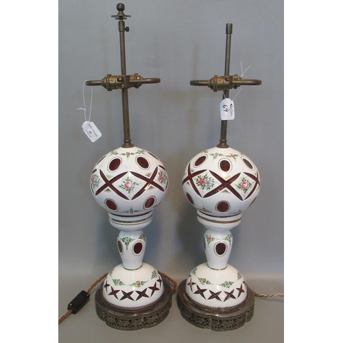 69 - Pair of late 19th century Bohemian overlay  cranberry glass table lamps, hand-painted with enamelled... 