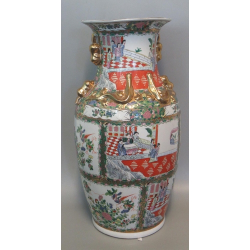 74 - A modern Chinese Famille Rose style floor vase decorated with figures in an interior, printed marks ... 