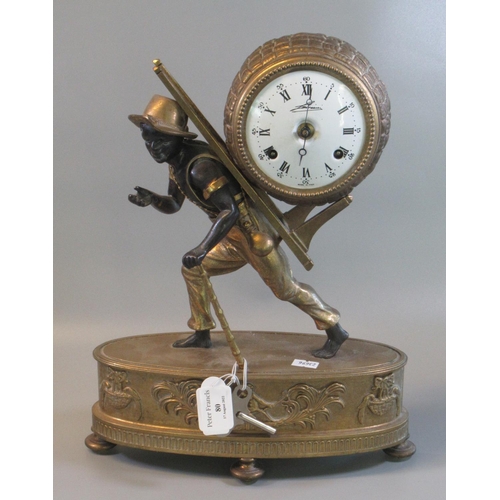 80 - Modern gilded brass two train mantle clock, overall with a figure of a young black boy with a barrel... 