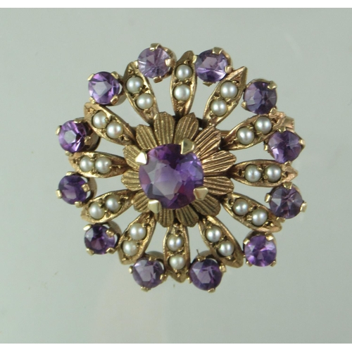 283 - A Victorian circle brooch set with amethyst and seed pearls.  Diameter approx 27mm.  Approx weight 5... 