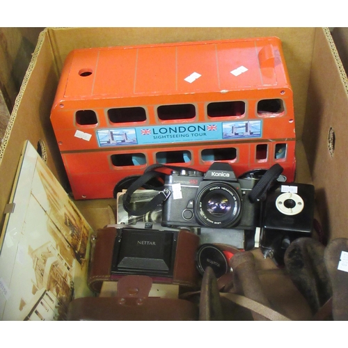 406 - Box of oddments, to include: Konica Autoreflex TC camera, plated hipflask, wooden toy model of a Lon... 