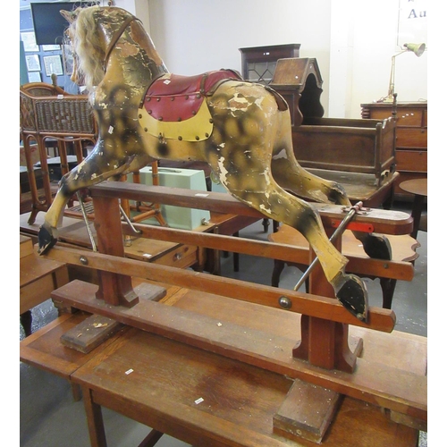 529 - Early 20th century child's rocking horse, with painted features on a patent swing stand.  (B.P. 21% ... 