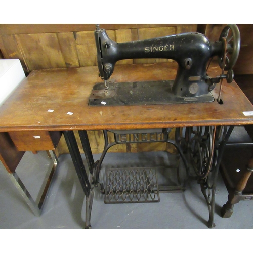 549 - Early 20th century Singer sewing machine on oak stand with cast iron Singer base.  (B.P. 21% + VAT)