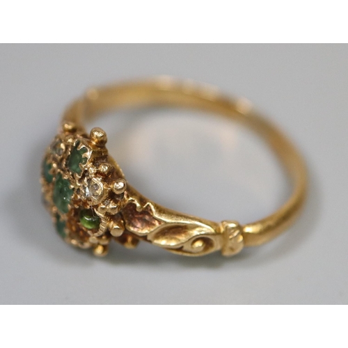 265 - Pretty flowerhead design yellow metal dress ring set with emeralds and diamonds.  2.6g. approx.  rin... 